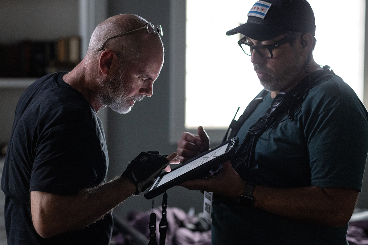 Anthony “ACE” Cabral reviewing production notes on set